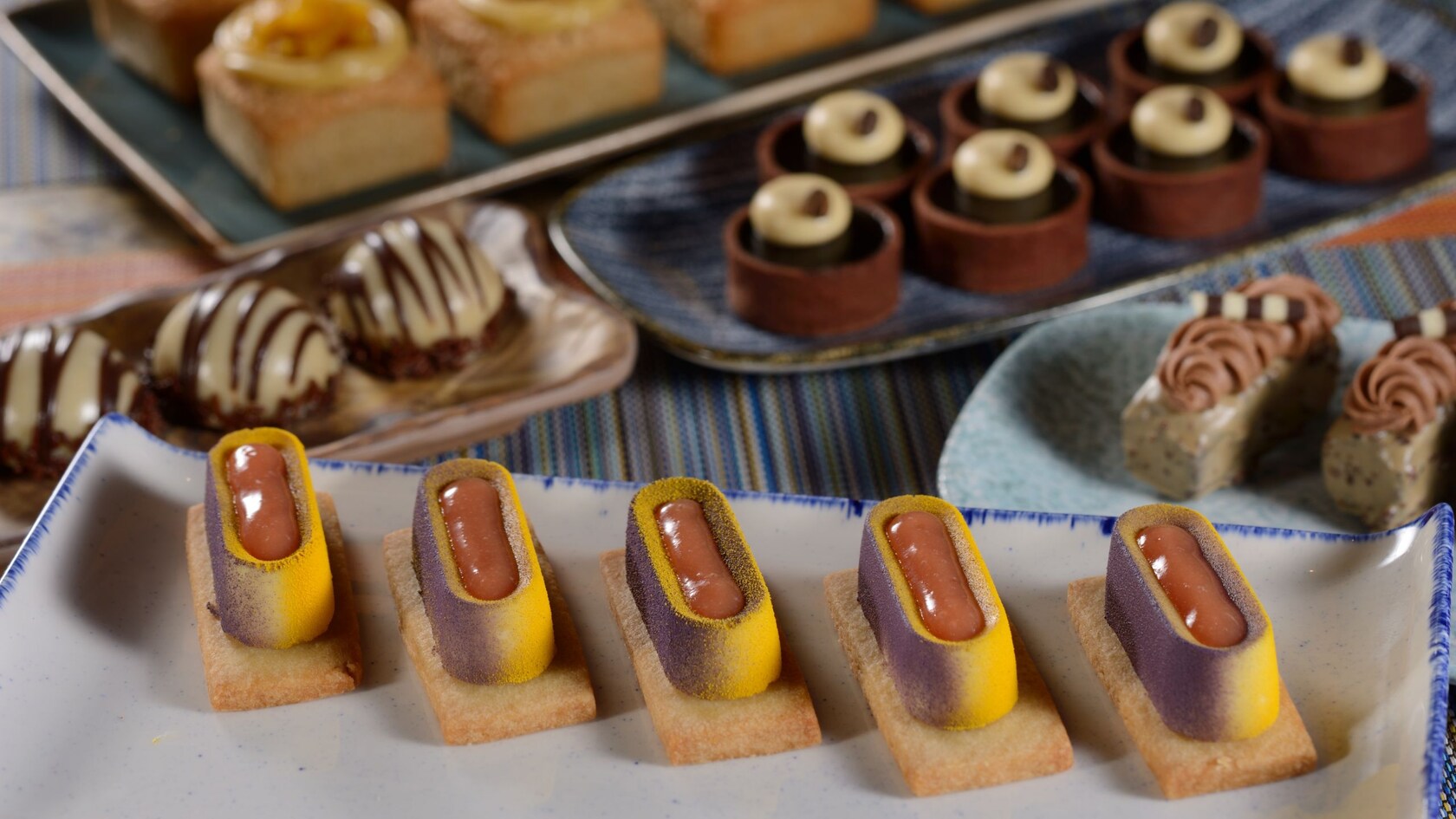 Several platters featuring various desserts