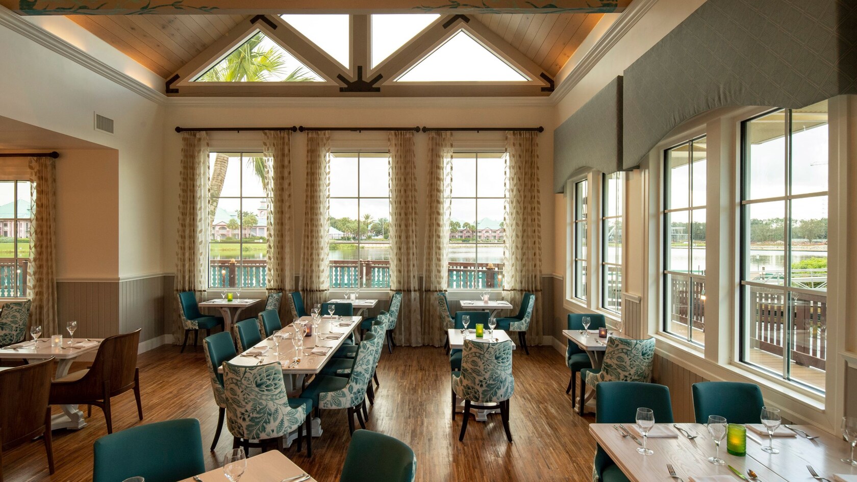 The attractive interior of Sebastian’s Bistro, with numerous tables to seat parties of different sizes, large windows and a waterfront view