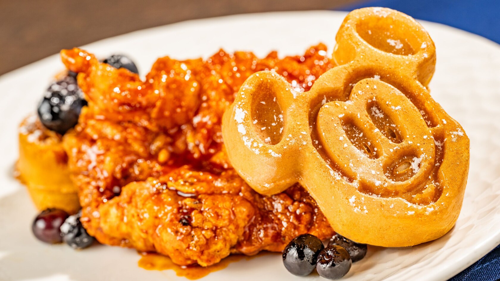 The Hot Honey Chicken and Waffles with Mickey shaped waffles at Ale & Compass Restaurant