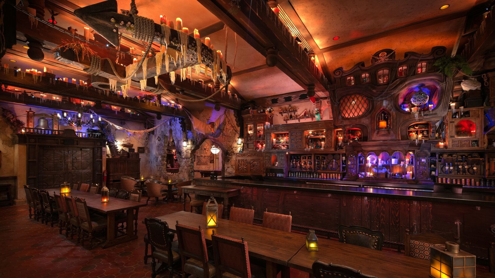 The interior of The Beak and Barrel, a pirate themed tavern decorated with relics such as a ship’s anchor, fishnets and candles