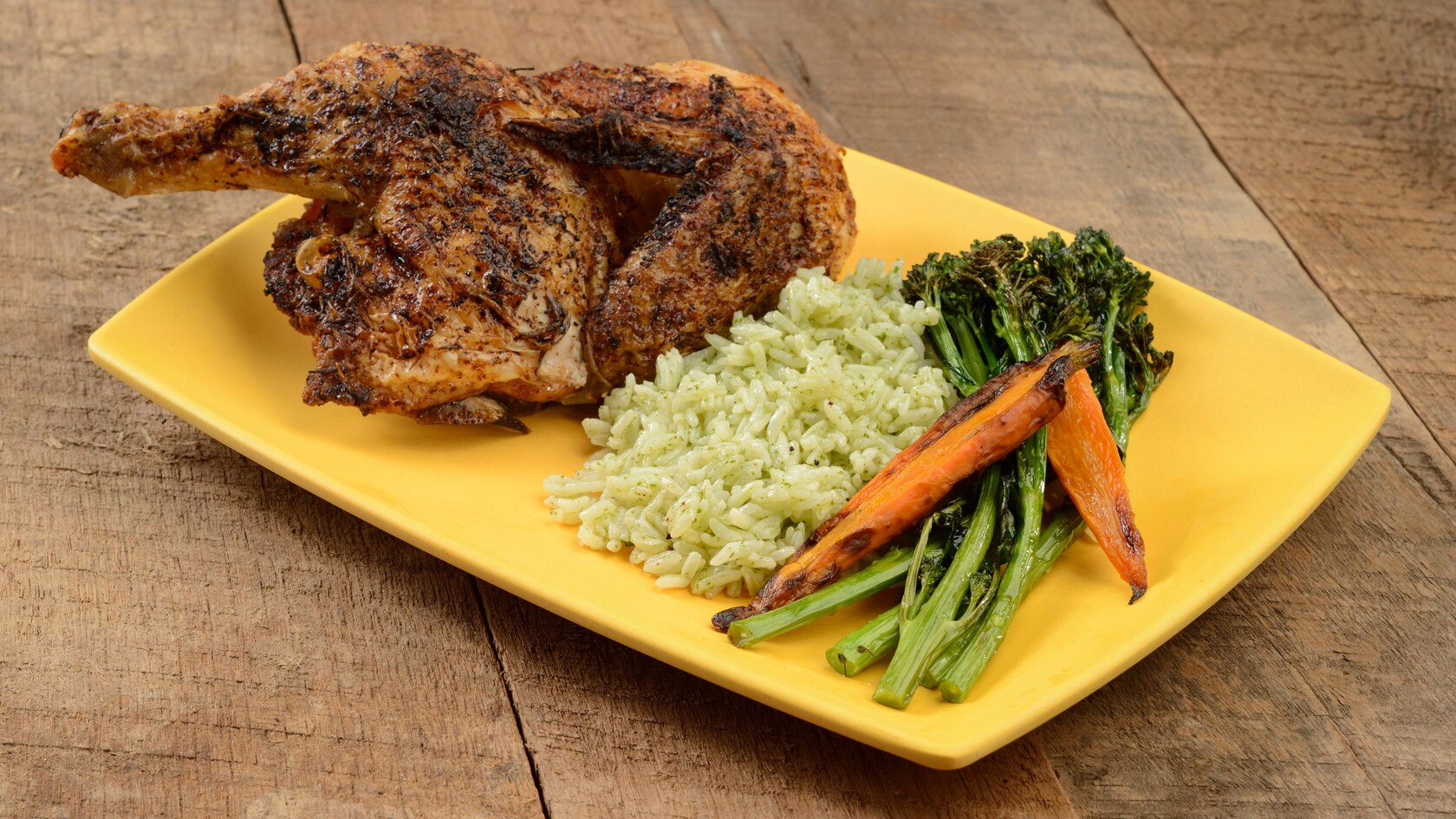Chicken, rice, asparagus and carrots on a plate