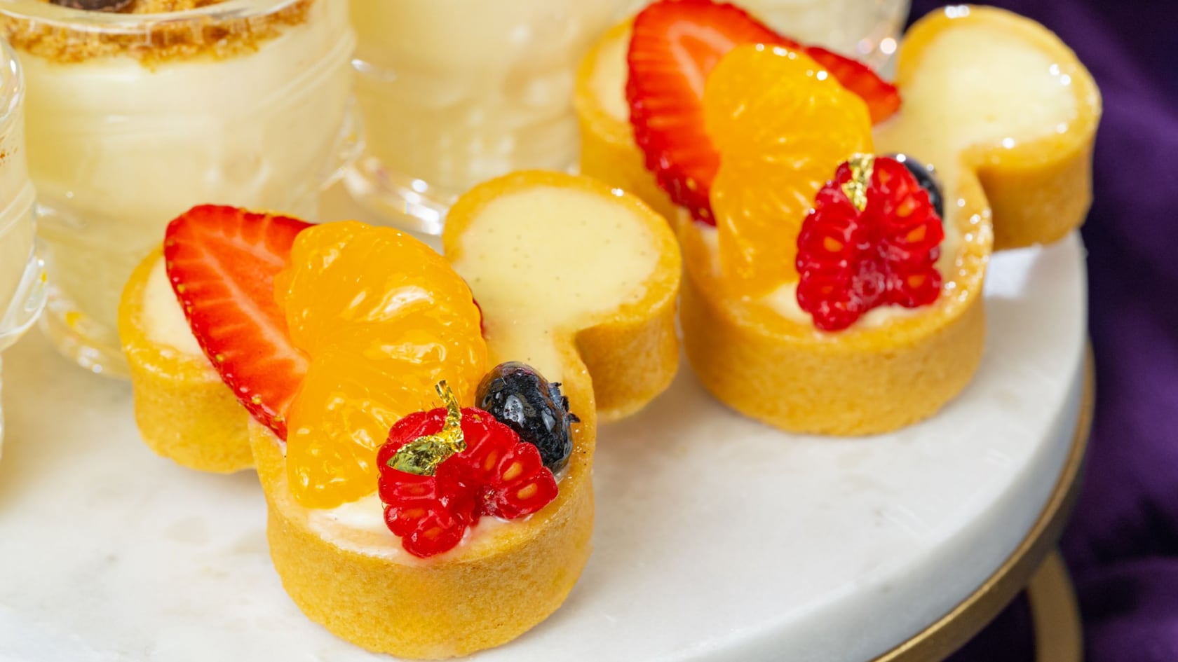 A pair of Mickey icon shaped fruit tarts