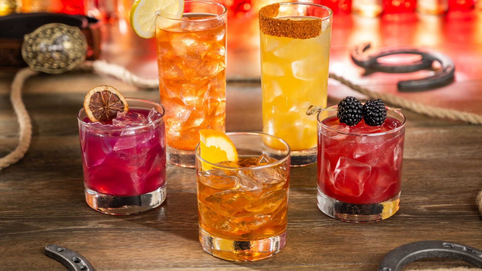 An assortment of 4 cocktails in glass mugs from Diamond Horseshoe Lounge at Magic Kingdom park