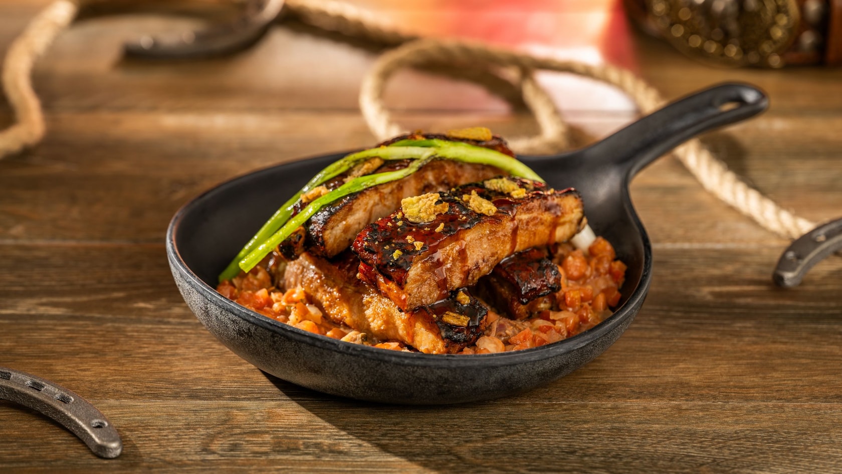 A pan of sticky ribs amid Old West themed decorations