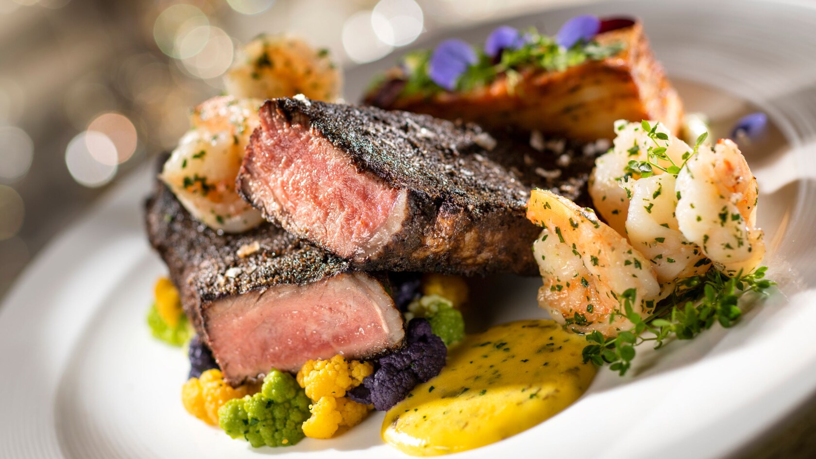 Char crusted New York strip with potato gratin, cauliflower and béarnaise sauce