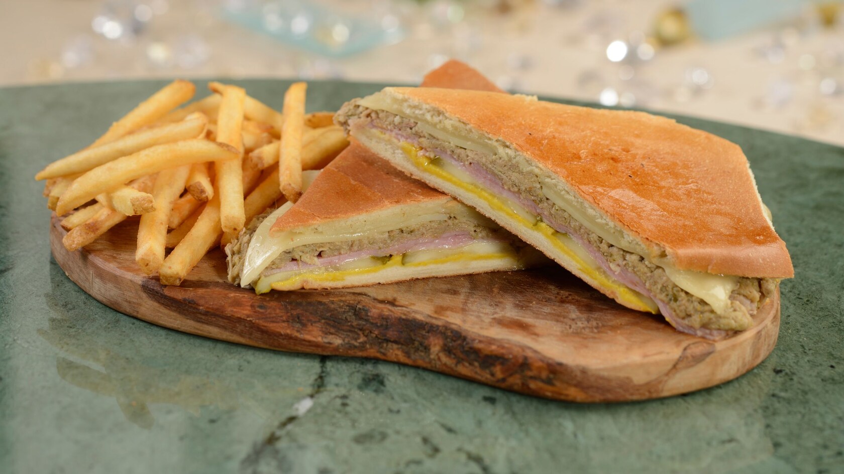 A Cuban sandwich served with an order of fries