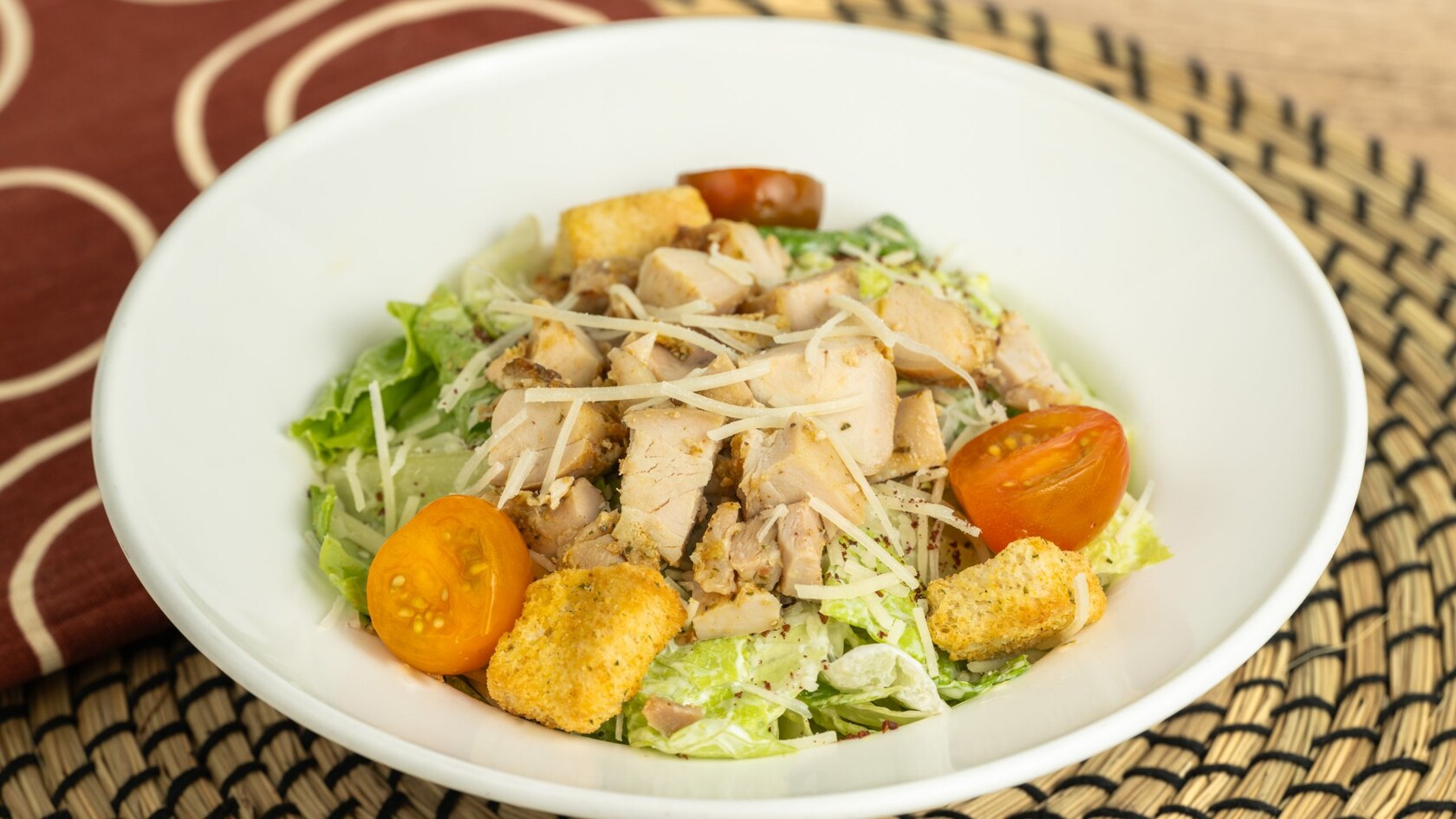 A bowl of chicken Caesar salad from Harambe Market