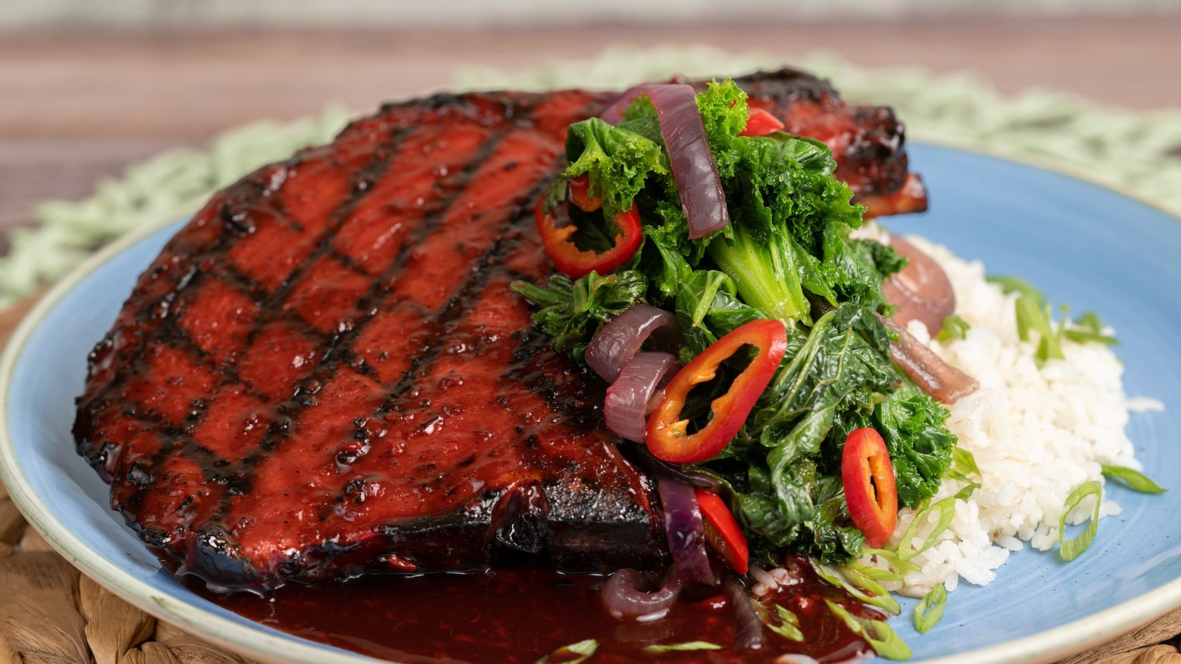 A plate featuring pork tenderloin with pickled vegetables and jasmine rice