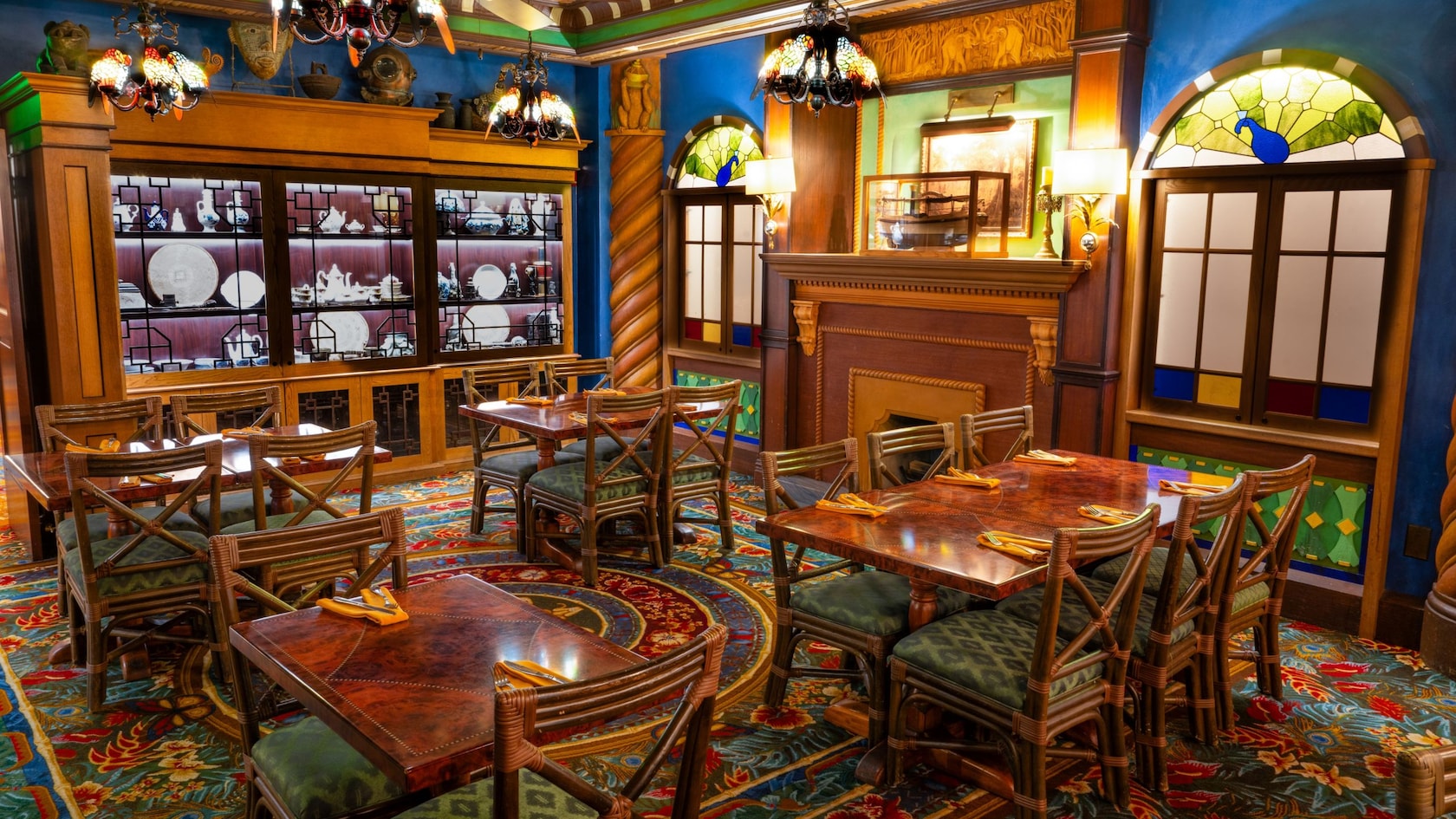 A dining room decorated with a large china cabinet at the Jungle Navigation Company Limited Skipper Canteen