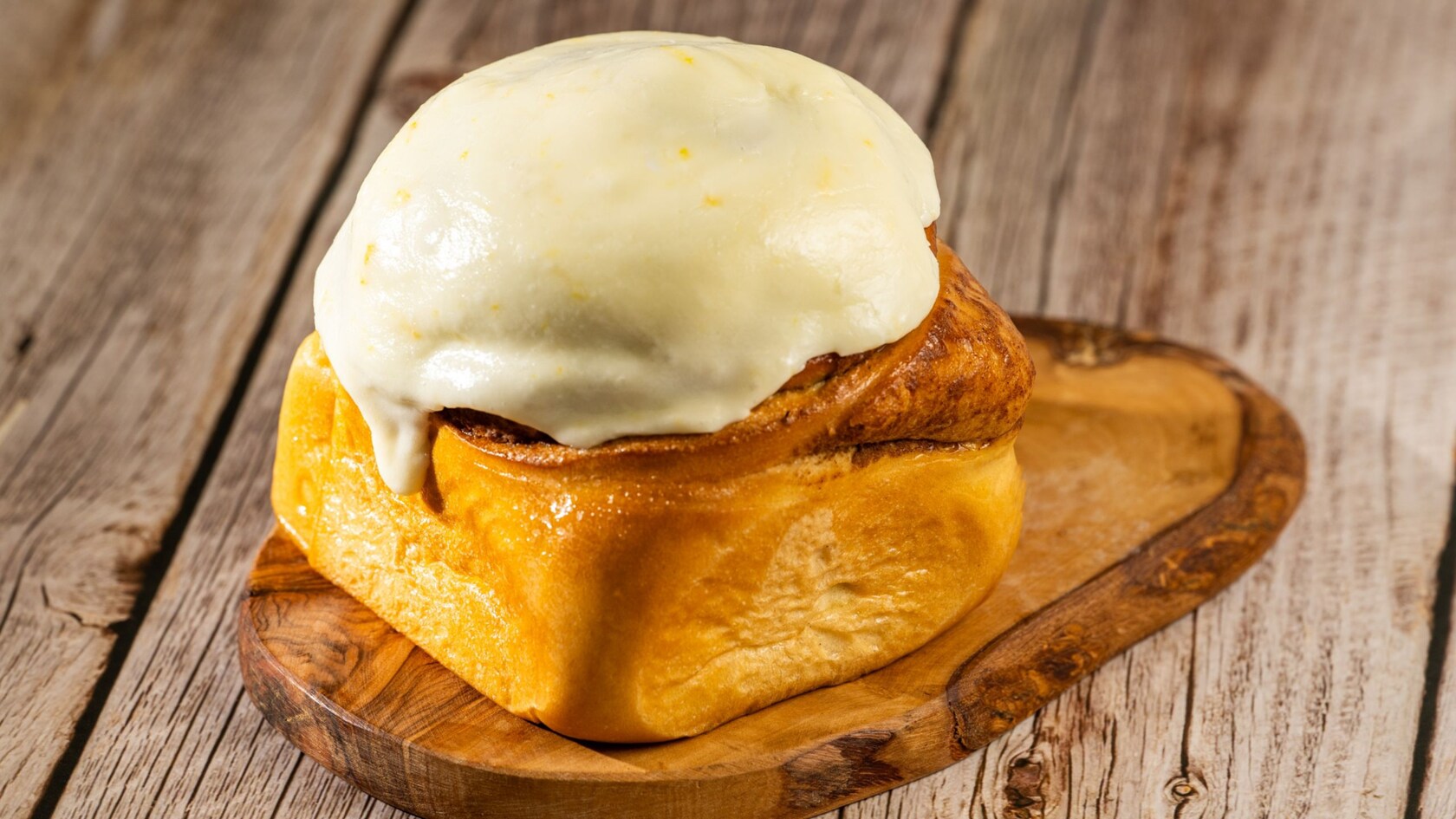 A Cinnamon Roll with Orange Cream Cheese Icing from Kringla Bakeri Og Kafe at Epcot