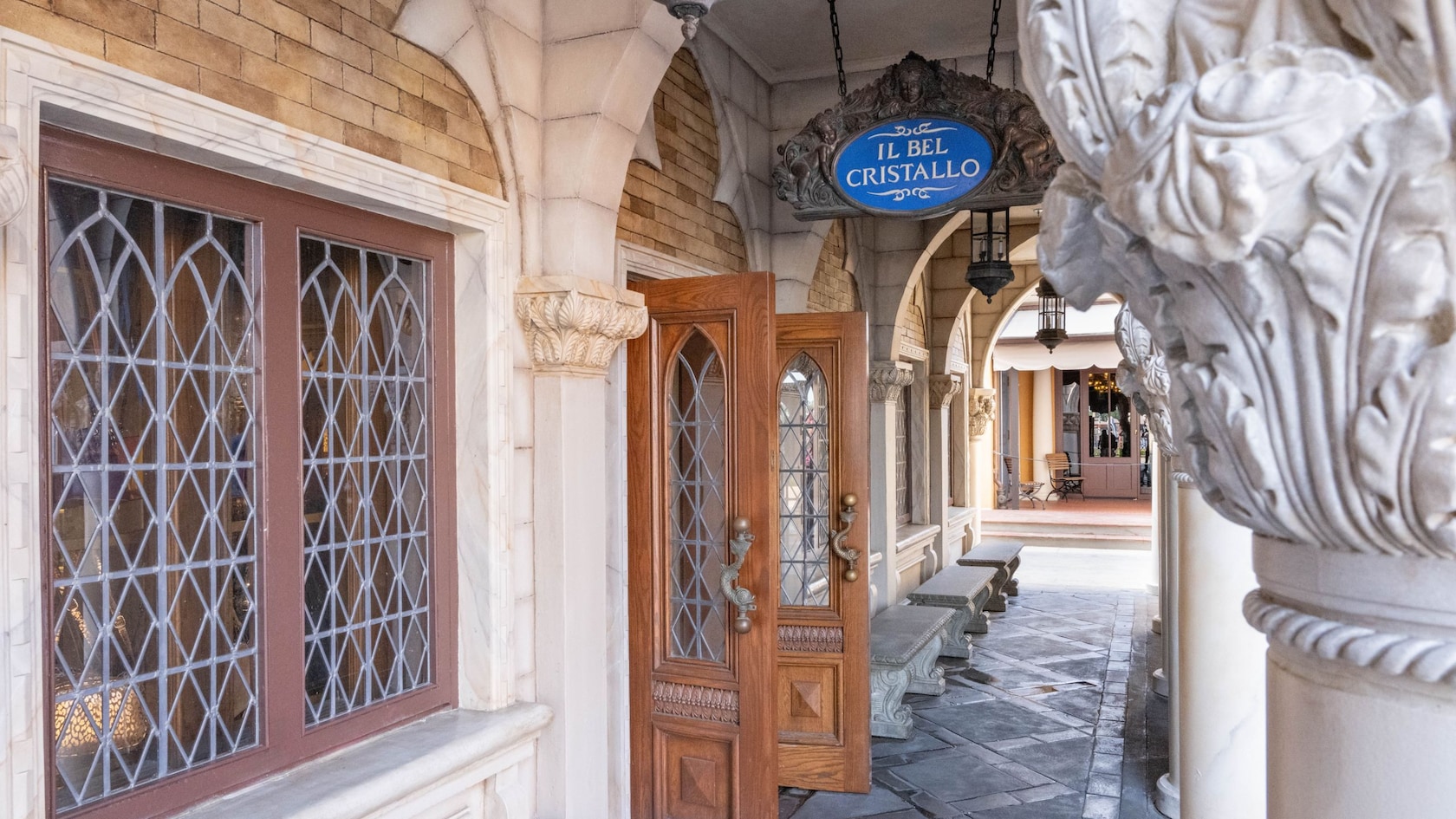 The colonnade of the main entrance and sign to Il Bel Cristallo located in World Showcase at Epcot
