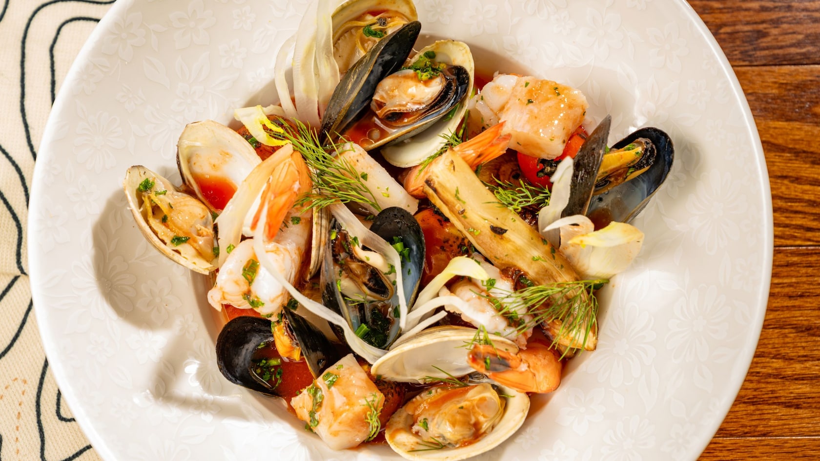 A plate of Seafood Cioppino from Le Cellier Steakhouse in Epcot