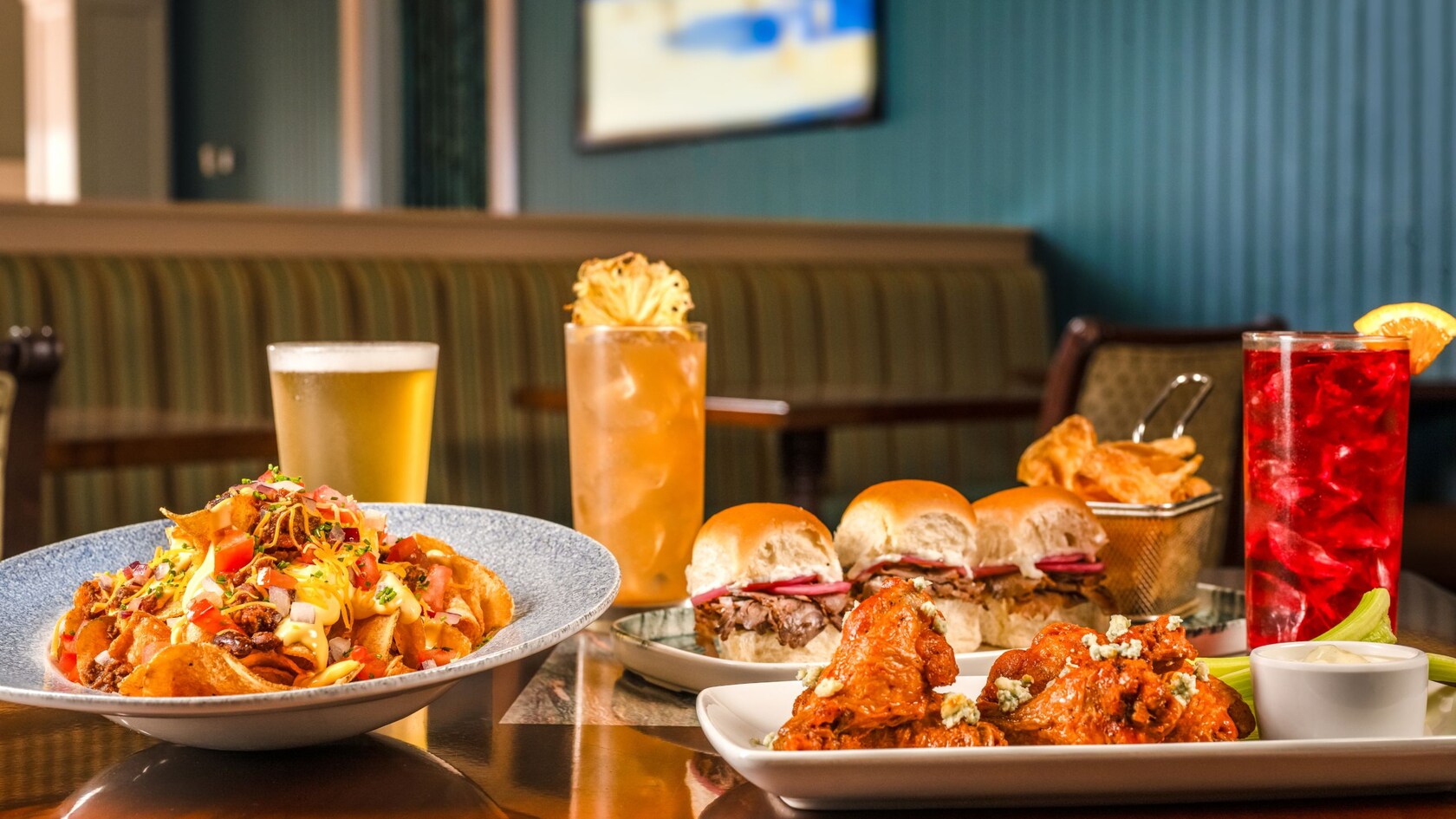 House Made Chips, Shaved Beef Sliders and Buffalo Glazed Wings with an assortment of beverages from Martha’s Vineyard at Disney’s Beach Club Resort