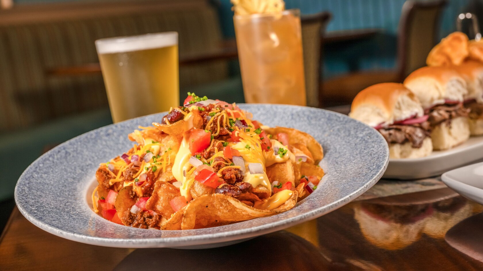 House Made Chips featuring chili, cheese sauce, red onions and tomatoes from Martha’s Vineyard at Disney’s Beach Club Resort
