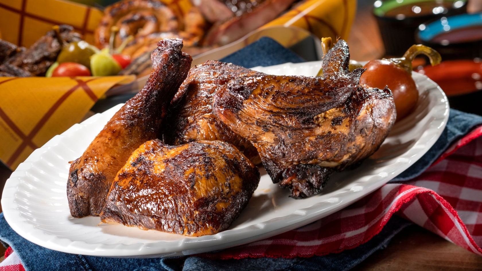 A plate of chicken and other barbecue dishes
