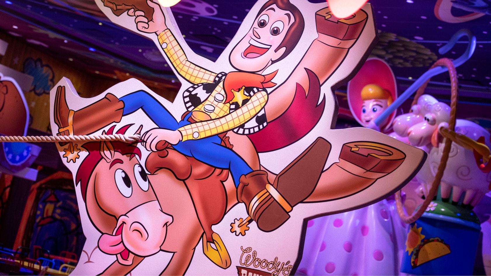 A large illustration of Woody riding Bullseye