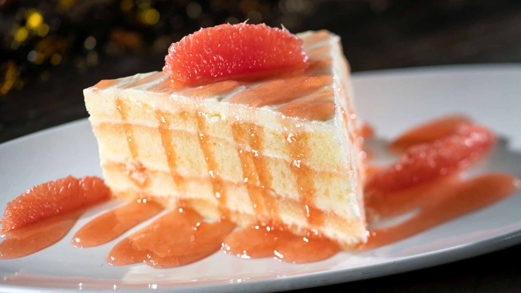 A slice of grapefruit cake on a plate