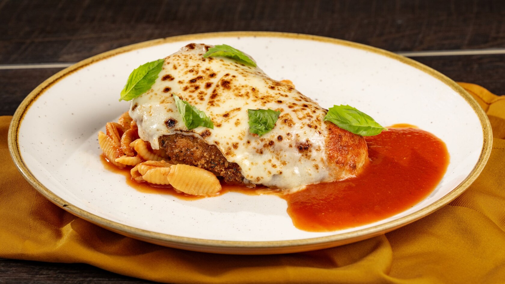 A plate of Parmigiana di Pollo from Trattoria al Forno in Disney’s Boardwalk