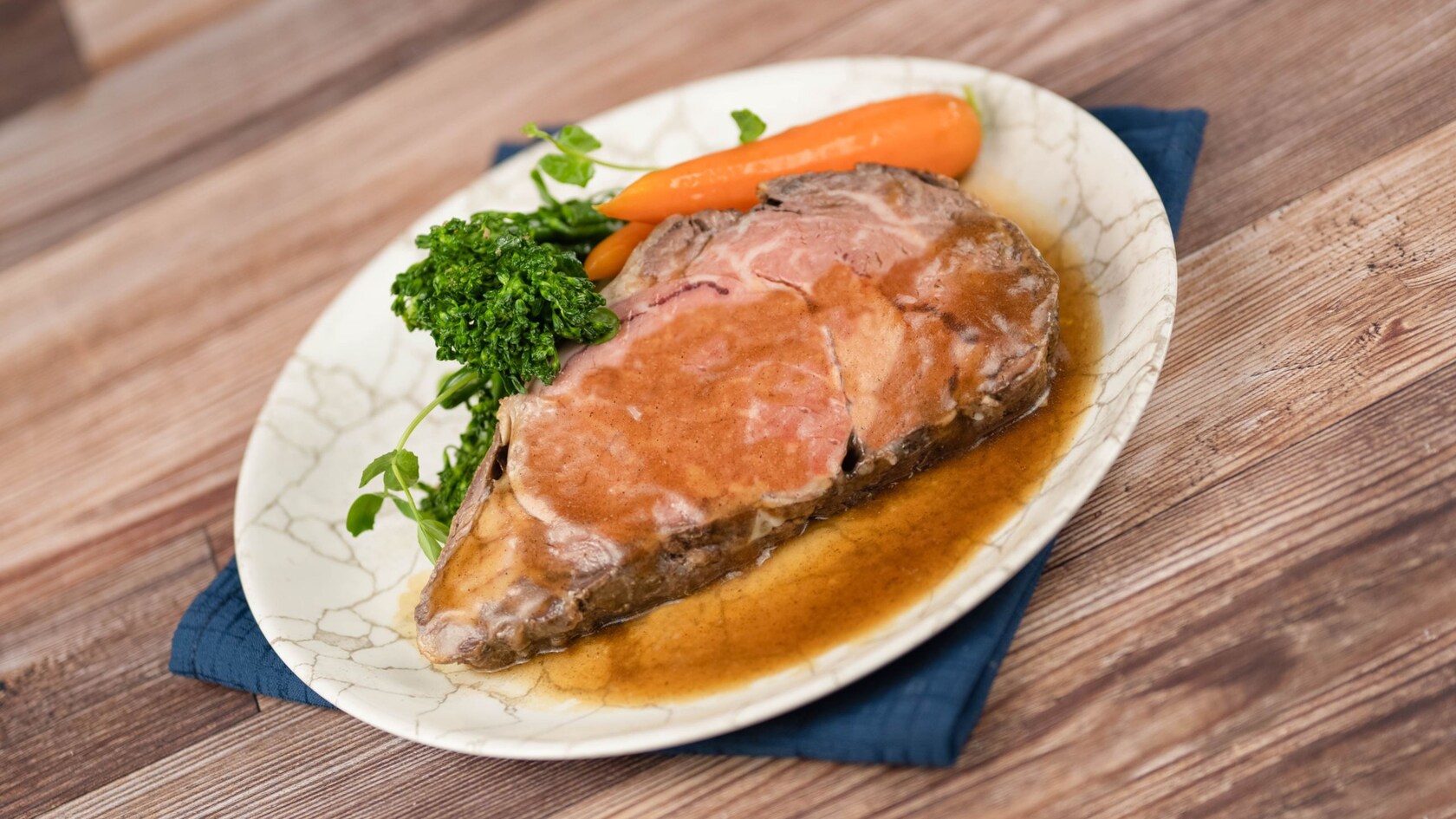 Slow Roasted Prime Rib with mashed potatoes, vegetables and a red wine reduction