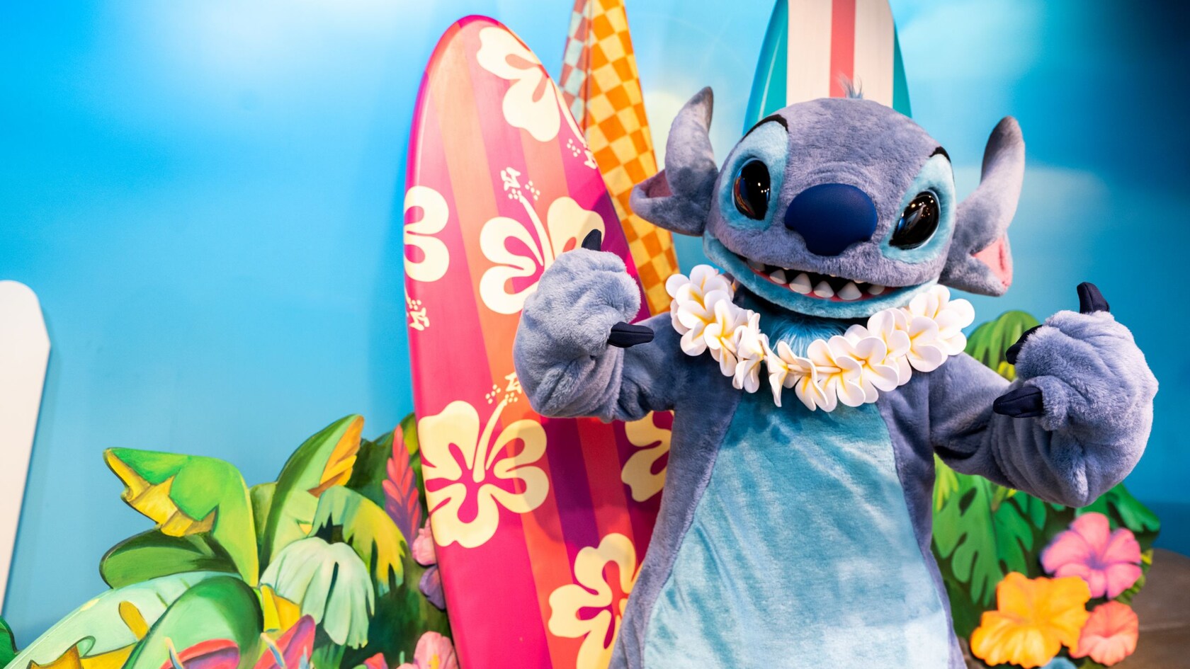 Stitch posing on a beach themed set 