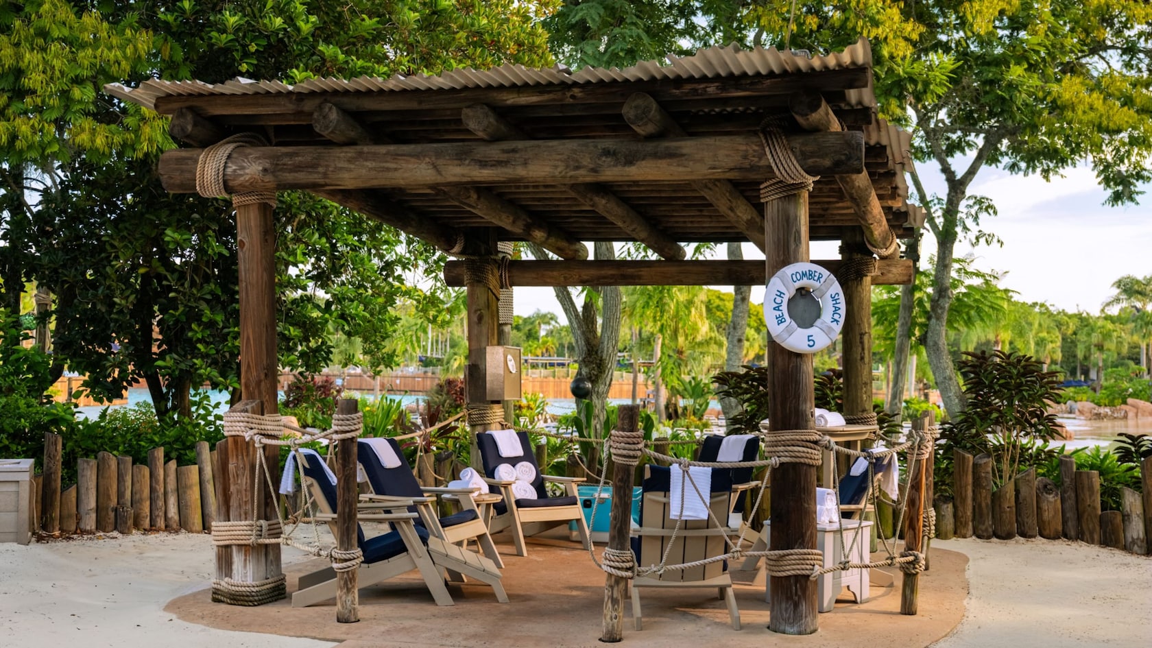 Beachcomber Shack 5, a shaded private cabana with lounge chairs at Disney's Typhoon Lagoon water park