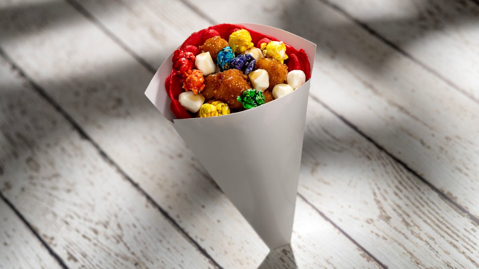 Popcorn, Popcorn Chicken and Waffles served in a cone