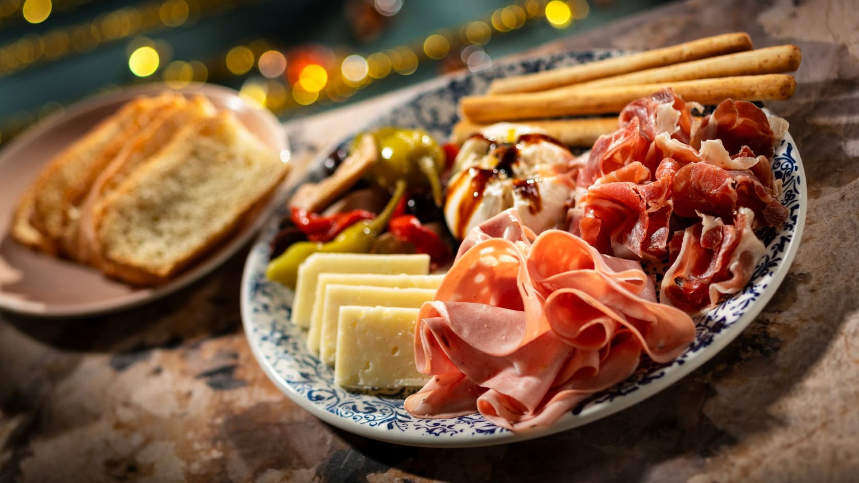 An antipasto platter with cured meats, cheeses, olives and breadsticks from Hurly Burly at Disney’s Boardwalk