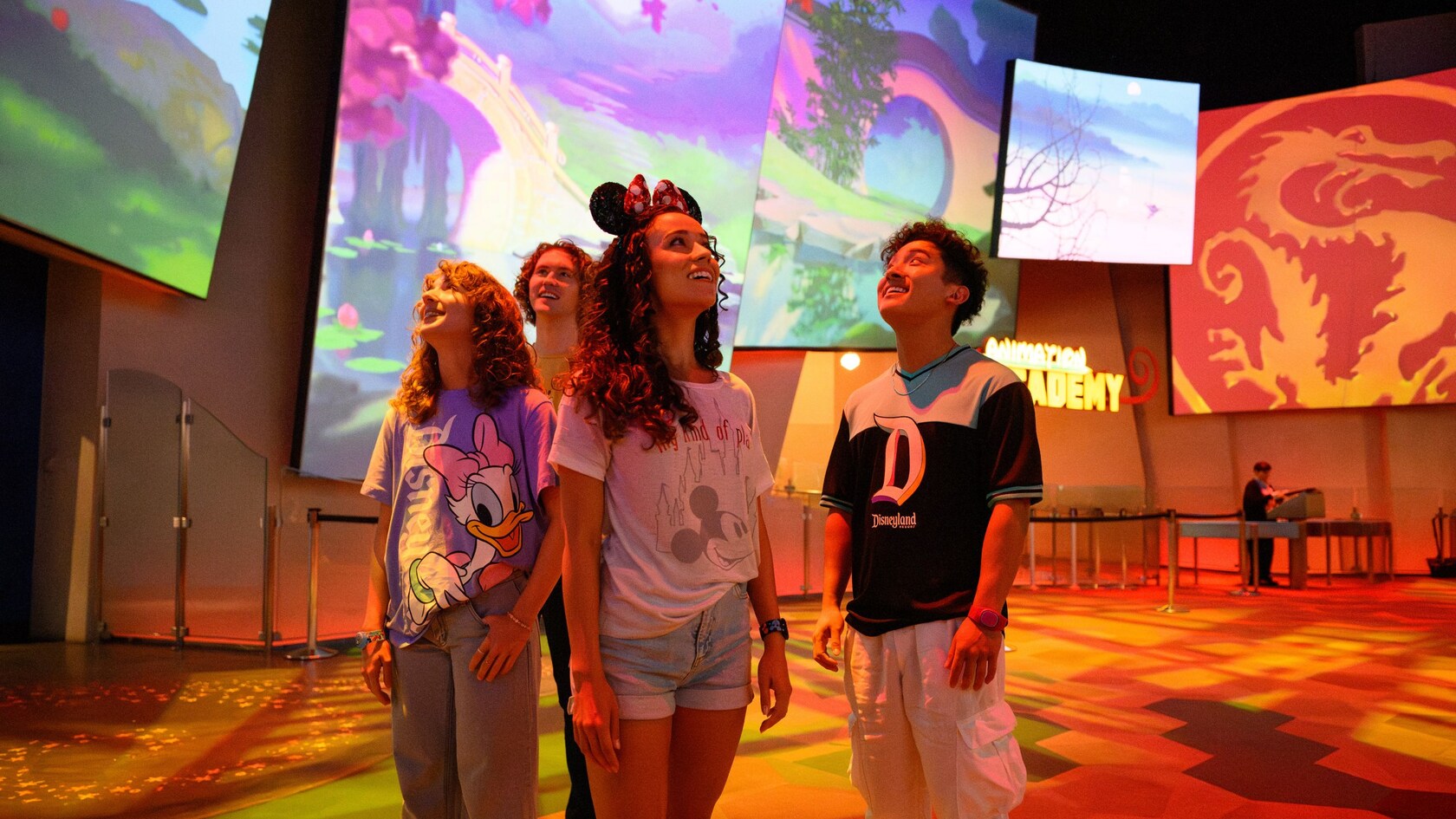 Four young Guests admiring an art exhibition at Animation Academy in Disney California Adventure Park