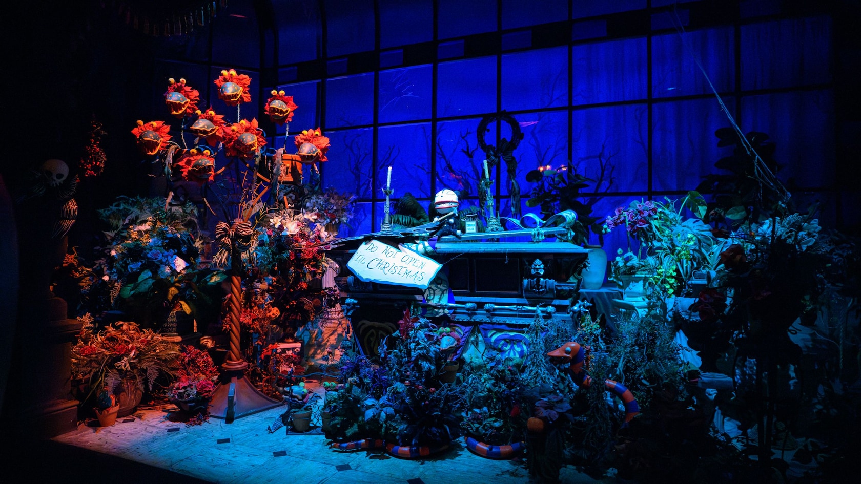 A coffin with decorations inspired by Tim Burton’s The Nightmare Before Christmas at Haunted Mansion Holiday