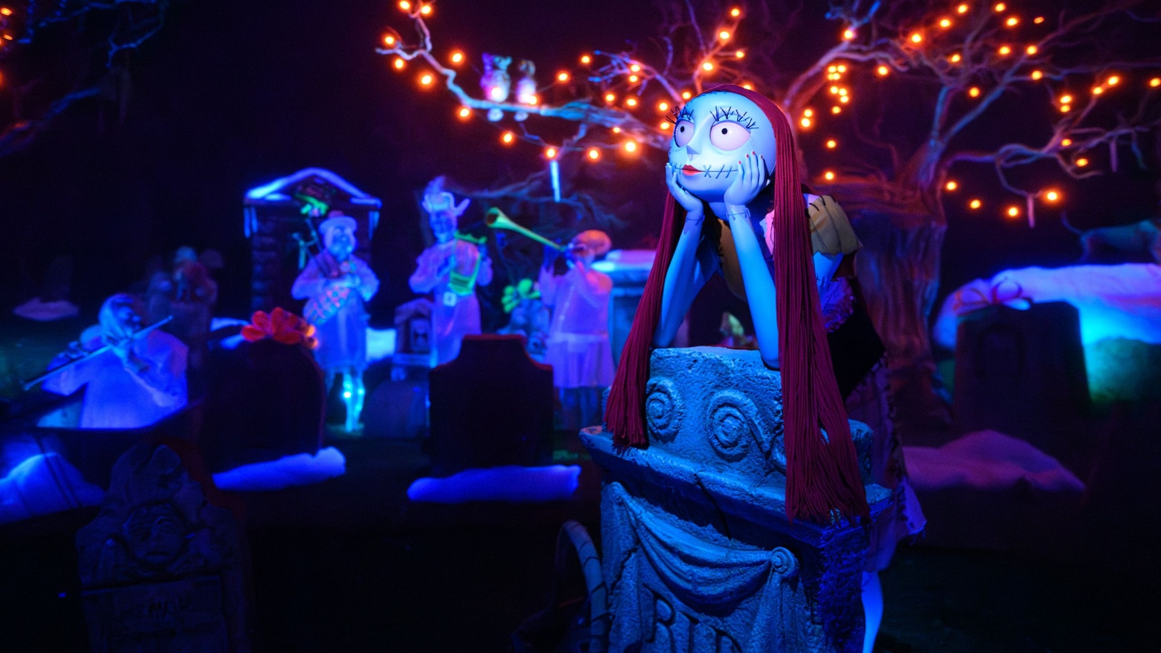 Sally from Tim Burton’s The Nightmare Before Christmas in a graveyard at Haunted Mansion Holiday