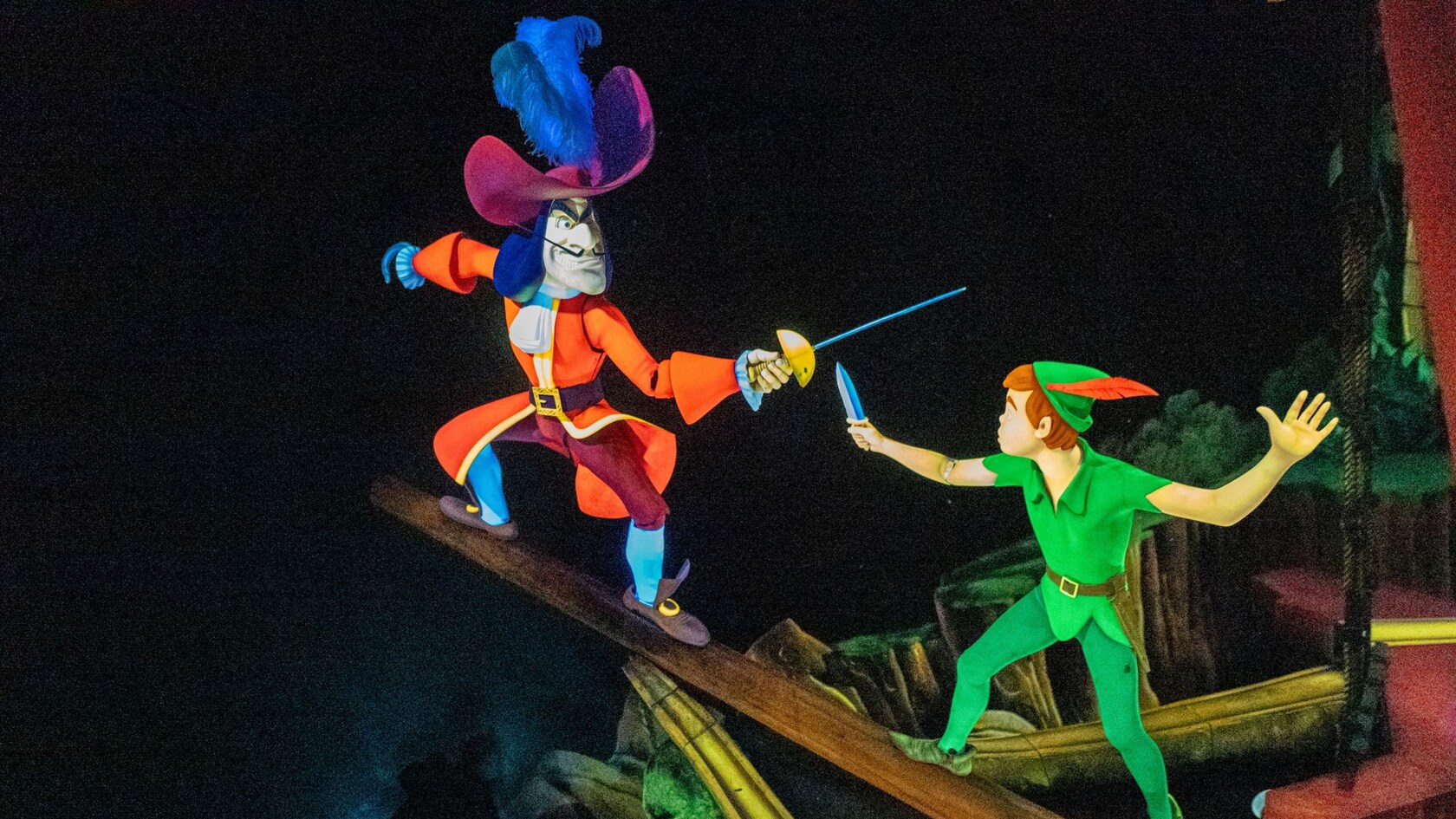 Peter Pan and Captain Hook dueling on the bowsprit of a pirate ship at Peter Pan’s Flight