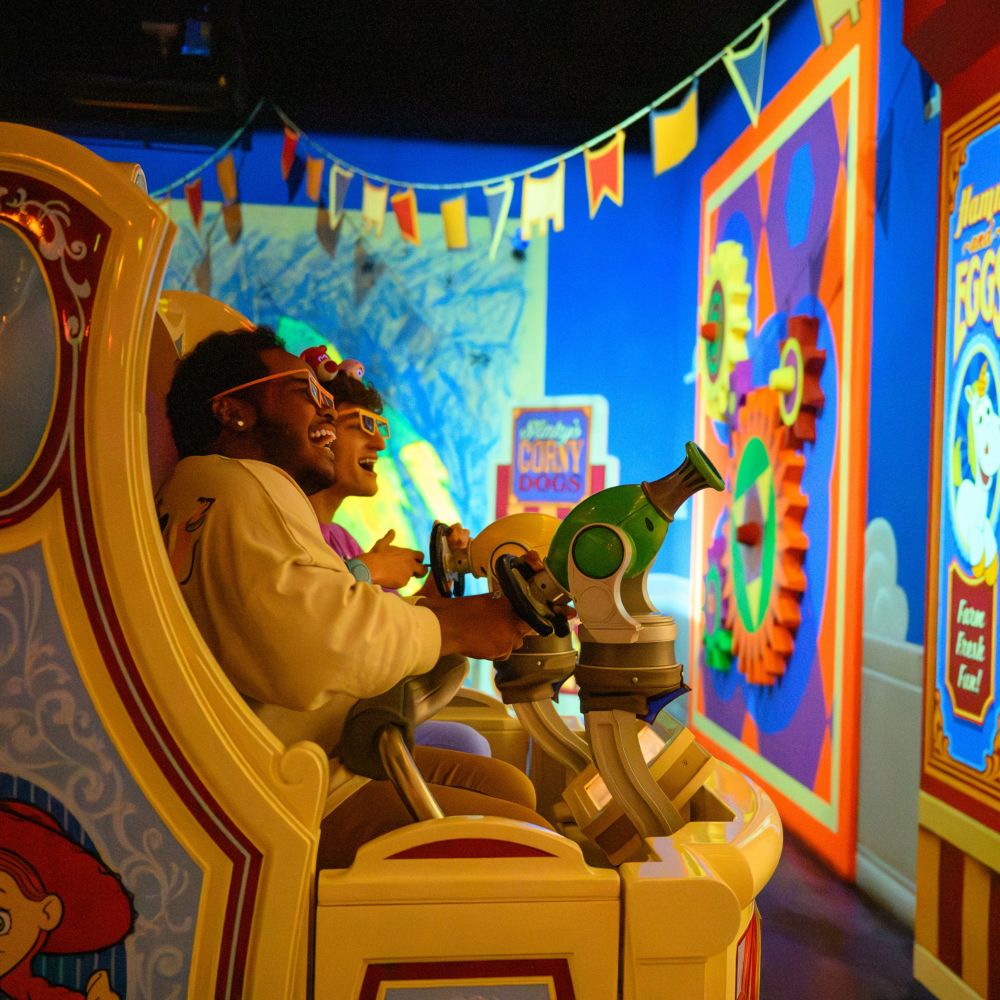 Guests enjoying their turn at the Toy Story Midway Mania attraction in Disney California Adventure Park
