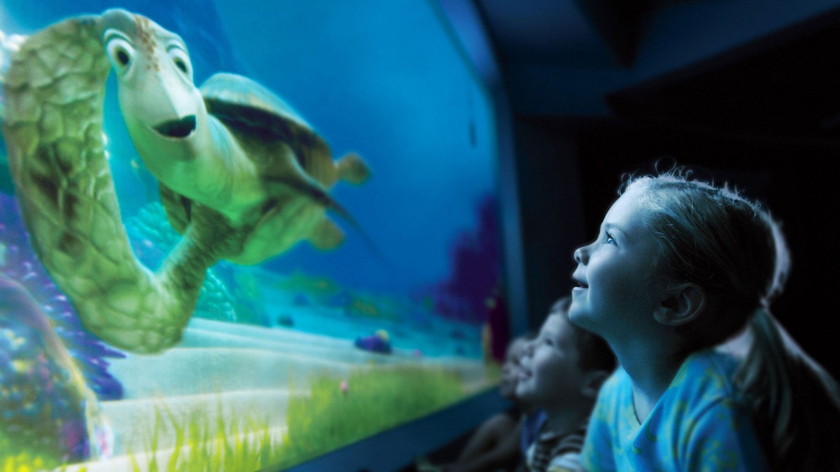 Young Guests and the turtle from the Disney Pixar film Finding Nemo enjoy a conversation