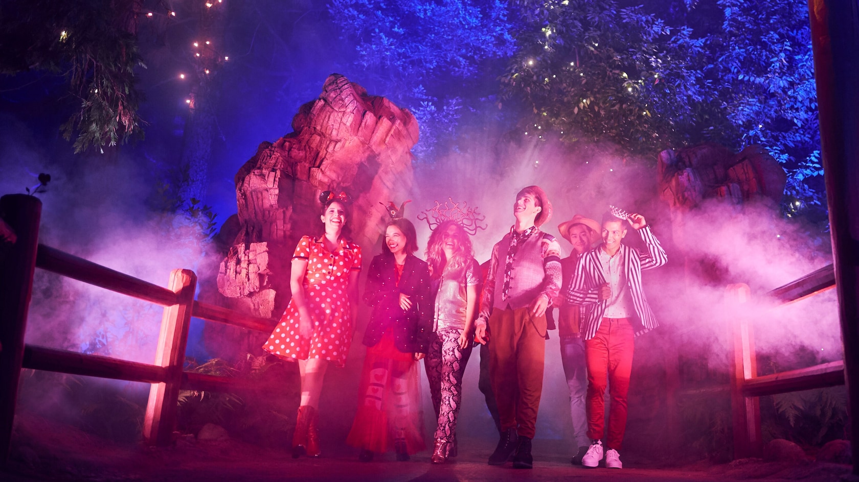 Guests dressed up in Halloween costumes taking in the spooky surrounding at Oogie Boogie Bash, A Disney Halloween Party