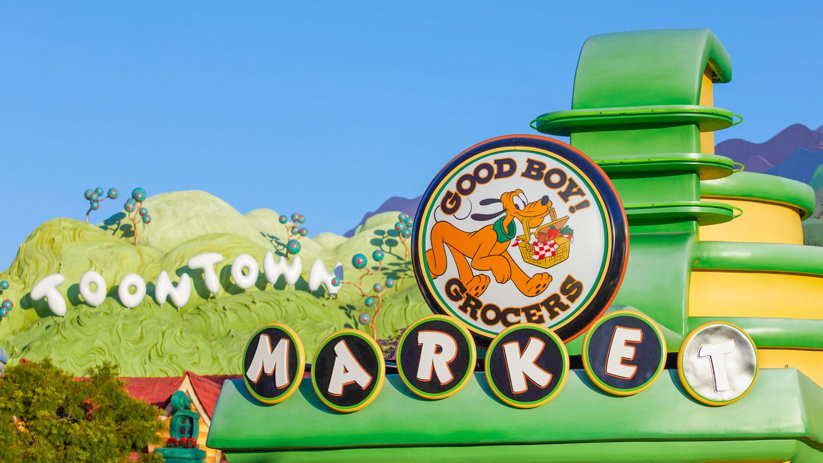 Good Boy Grocers featuring Pluto on a sign in Mickey’s Toontown at Disneyland Park