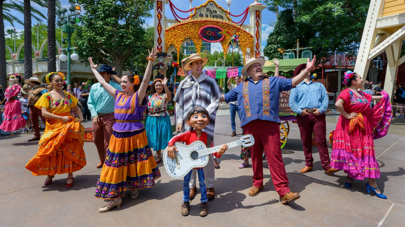 People performing in The Storytellers of Plaza de la Familia Celebrate The Musical World of Coco! show