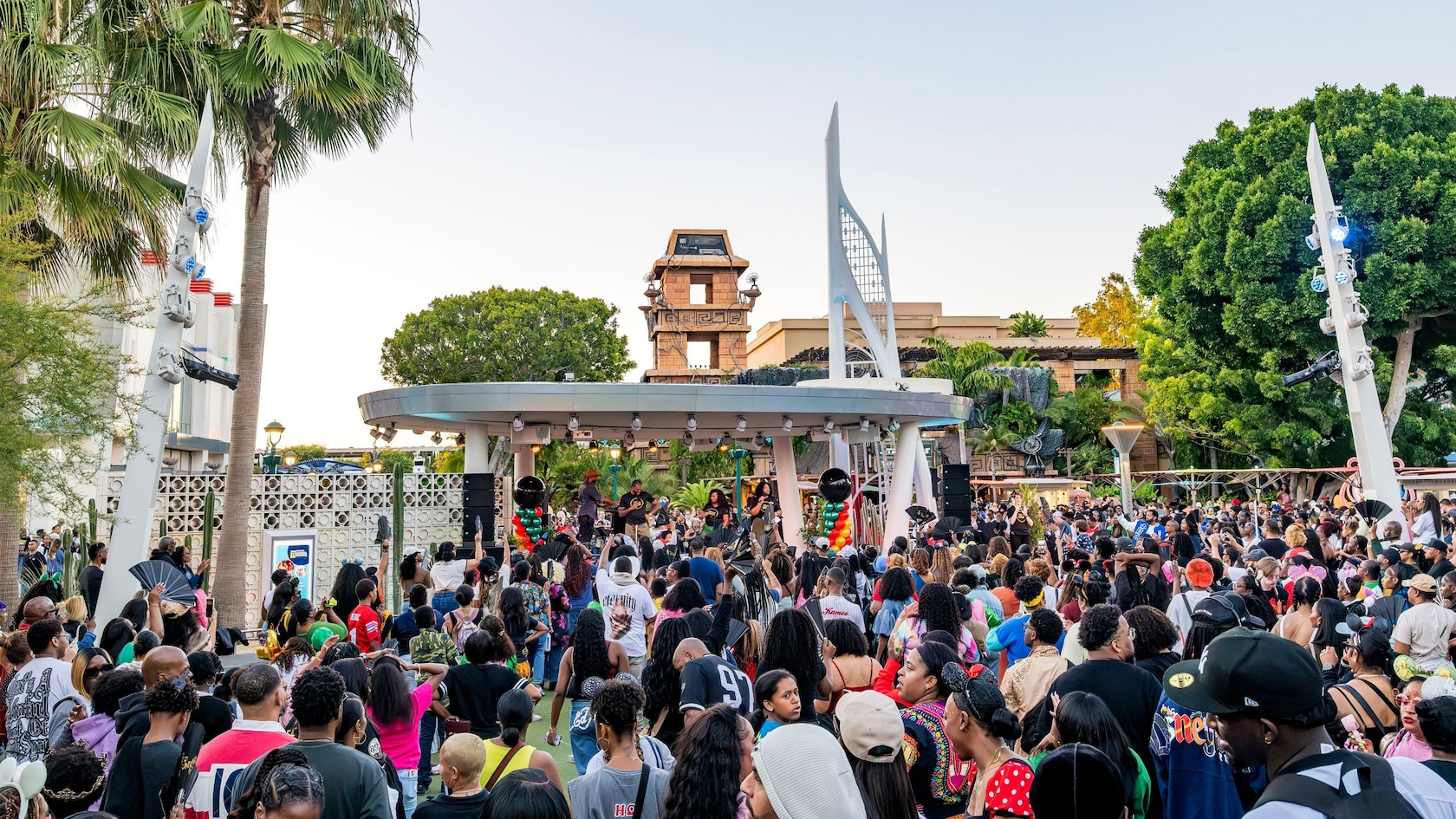 View of a large crowd gathered around the Downtown Disney District stage during Disney on the Yard Yardfest 2026