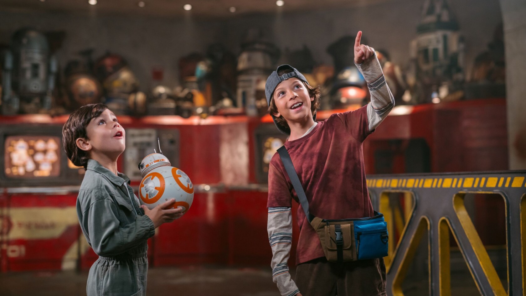 Two young boys inside Droid Depot at Star Wars: Galaxy's Edge  