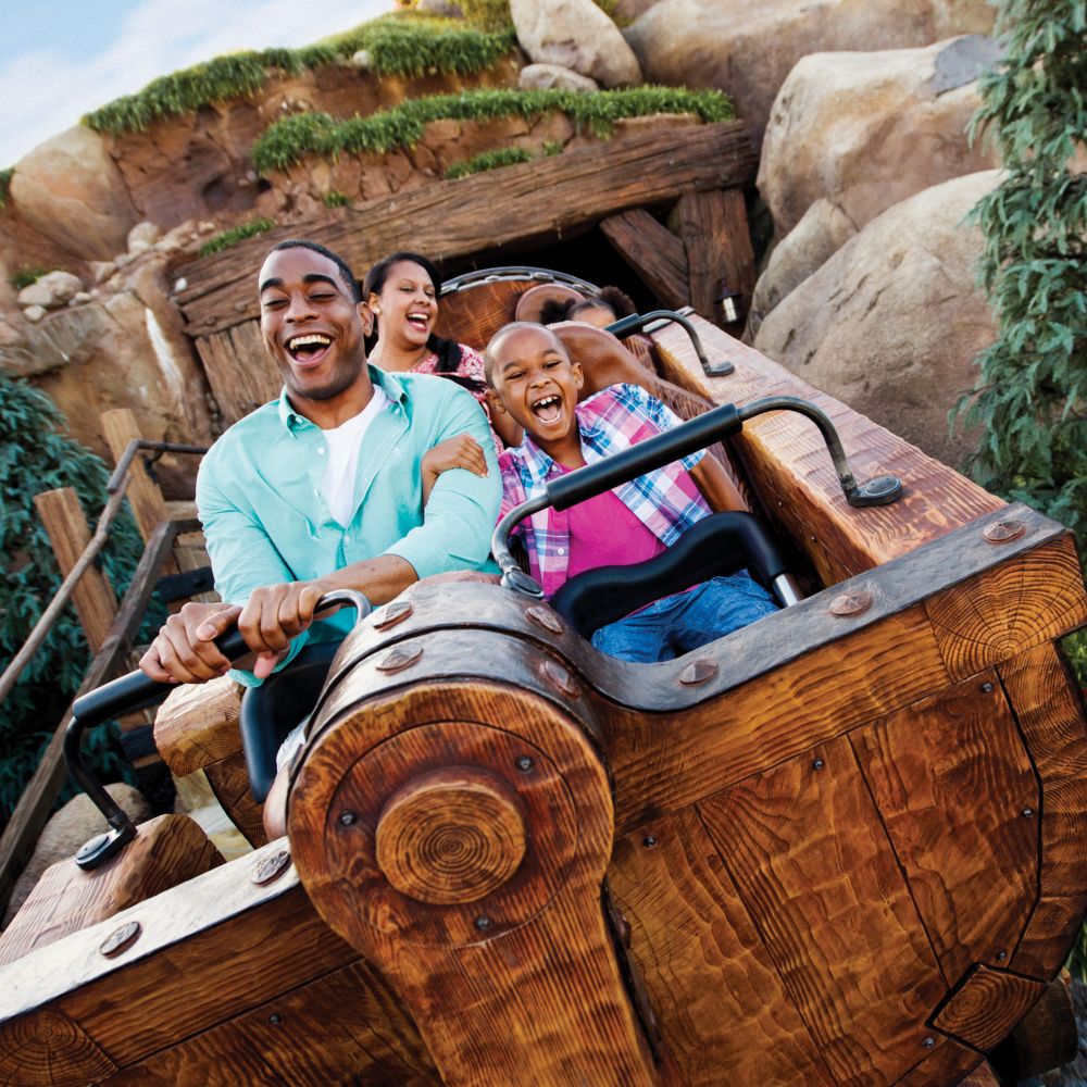 Guests riding Seven Dwarfs Mine Train