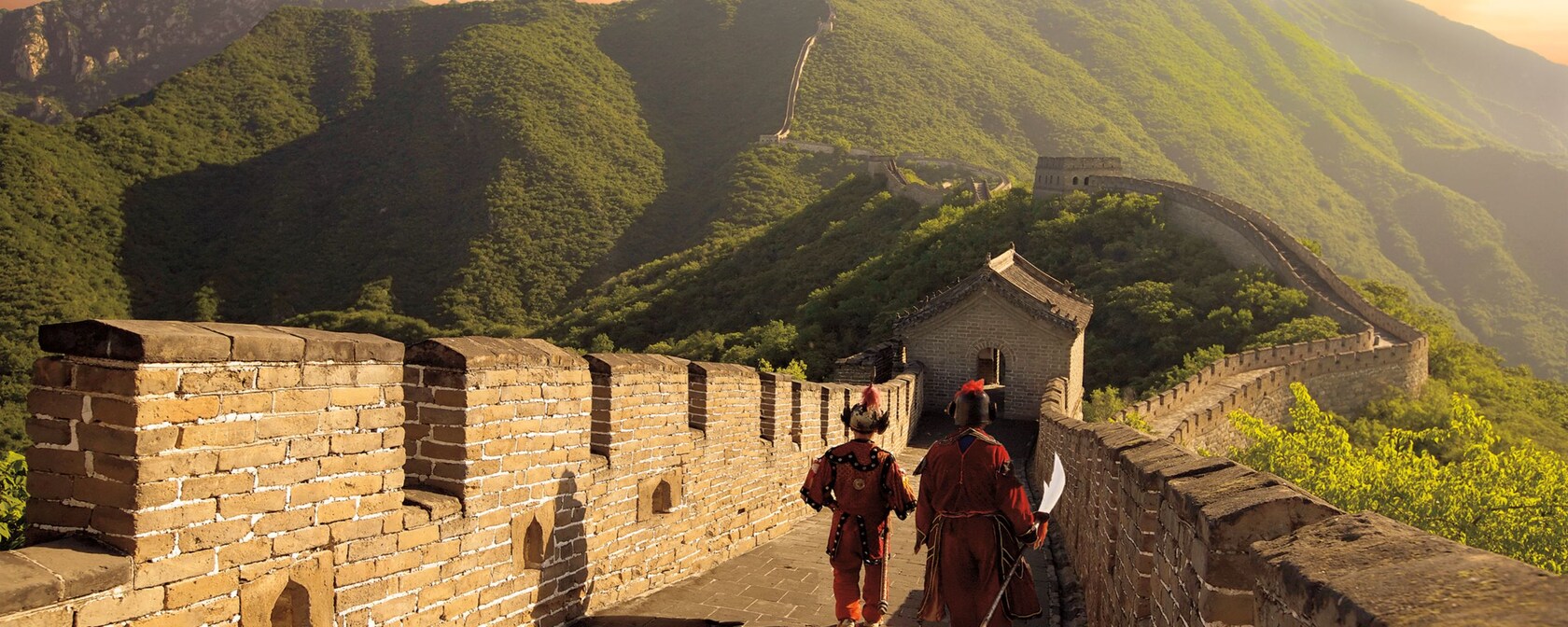 Two men walking along the Great Wall of China