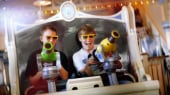 Two teen boys use their spring-action shooter on the Toy Story Mania! Attraction