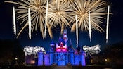 An amazing fireworks spectacular lights up the night over Sleeping Beauty Castle