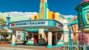 An illustration of a movie marquee showing Mickey and Minnie’s Runaway Railway, with Mickey and Minnie greeting Guests