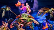 A Finding Nemo show with performers dressed as turtles Marlin and Dory