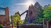 A train speeds through the Himalayan mountains on Expedition Everest Legend of the Forbidden Mountain
