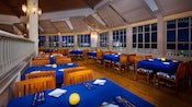 The inside of Narcoossees with set tables and chairs
