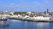 The Southampton port in England with waterfront buildings, docked boats and a pier