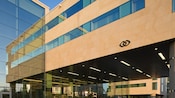 A skyway connected to the glass and stone entrance of the Sofitel London Heathrow Hotel