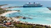 A Disney Cruise Line ship docked at a beach in Castaway Cay