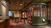 A section of the French Quarter Lounge featuring a table with chairs and a seating area within a replica street car